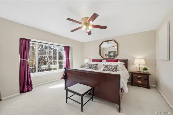 a bed room with a bed and a chandelier