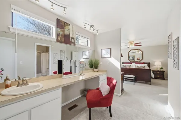 a bedroom with a bed and a couch