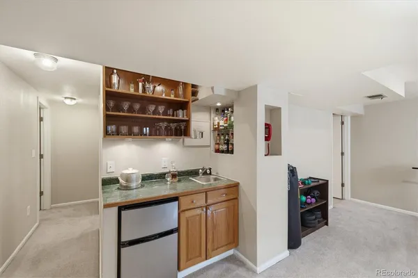 a bedroom with a bed and a lamp