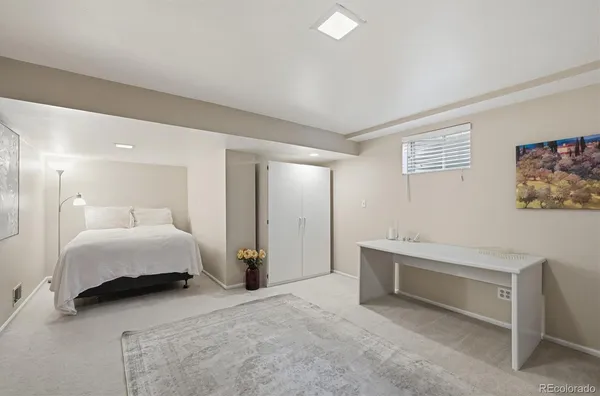 a view of a livingroom with furniture and a flat screen tv