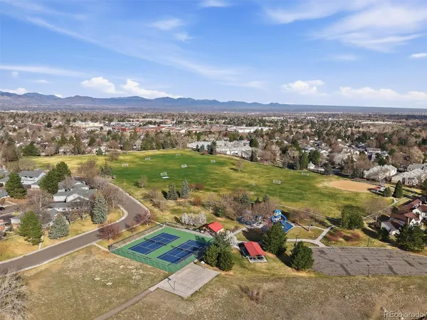 a bathroom with a black and white checkered floor