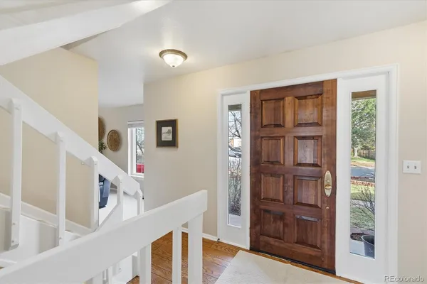 a view of a livingroom with furniture and workspace
