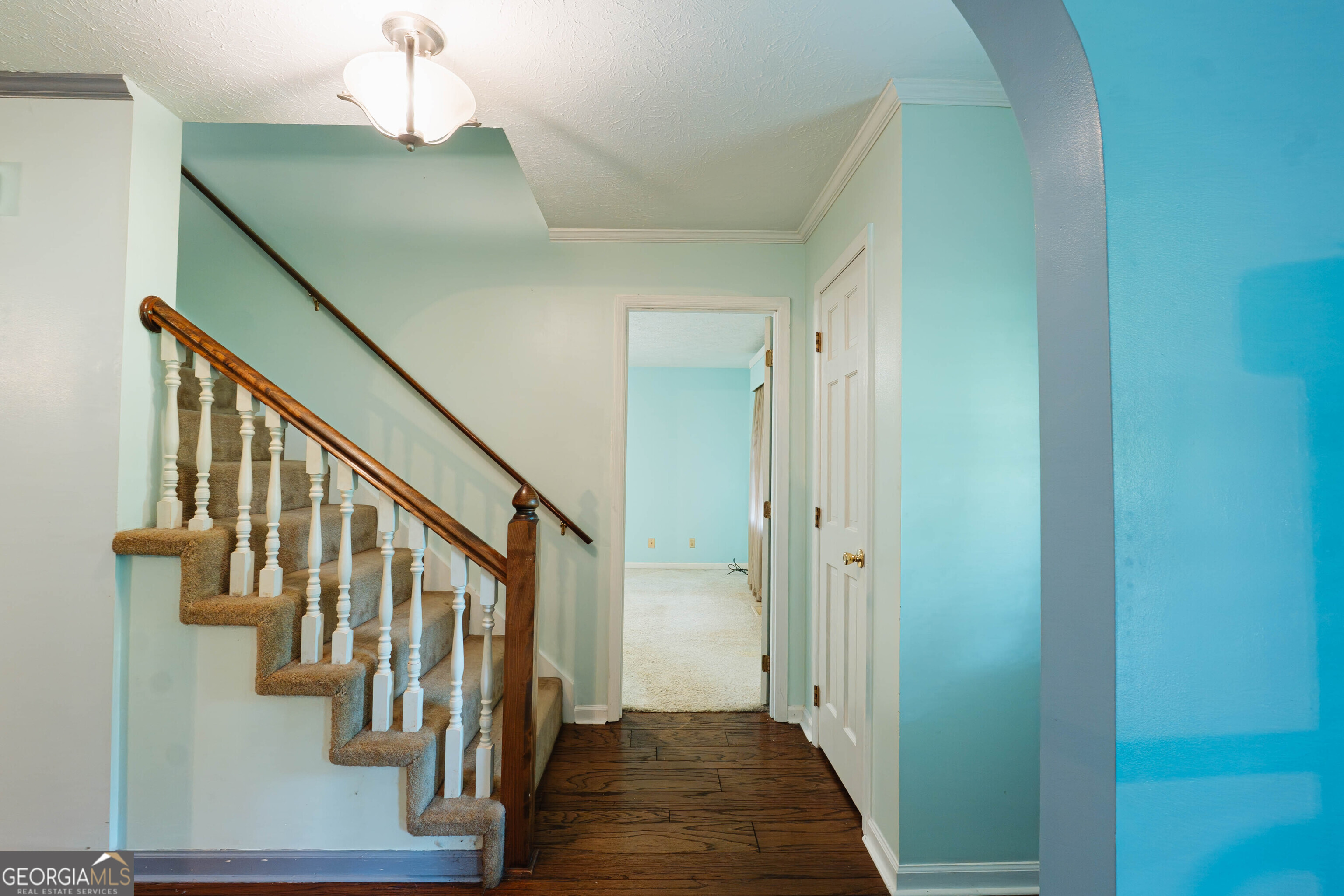 139 Cords Bridge Road Northeast Milledgeville, GA 31061 - Photo 12 of 35 a view of a hallway with wooden floor and staircase
