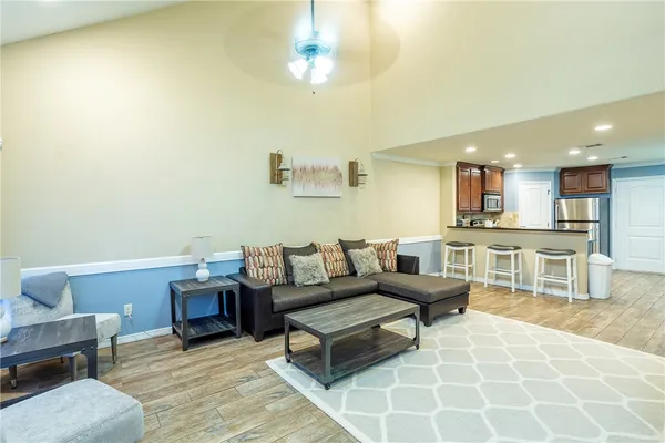 a living room with furniture and a table