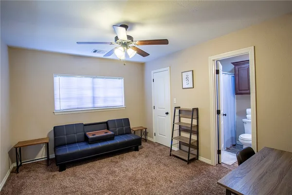 a living room with furniture and a window