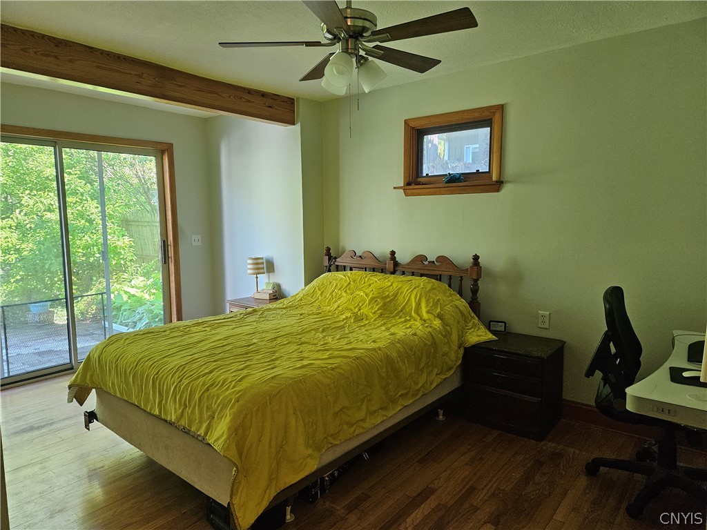 214 Revere Road DeWitt, NY 13214 - Photo 9 of 17 The owners will miss this large first floor bedroom with sliding glass door to patio and PRIVATE back yard.