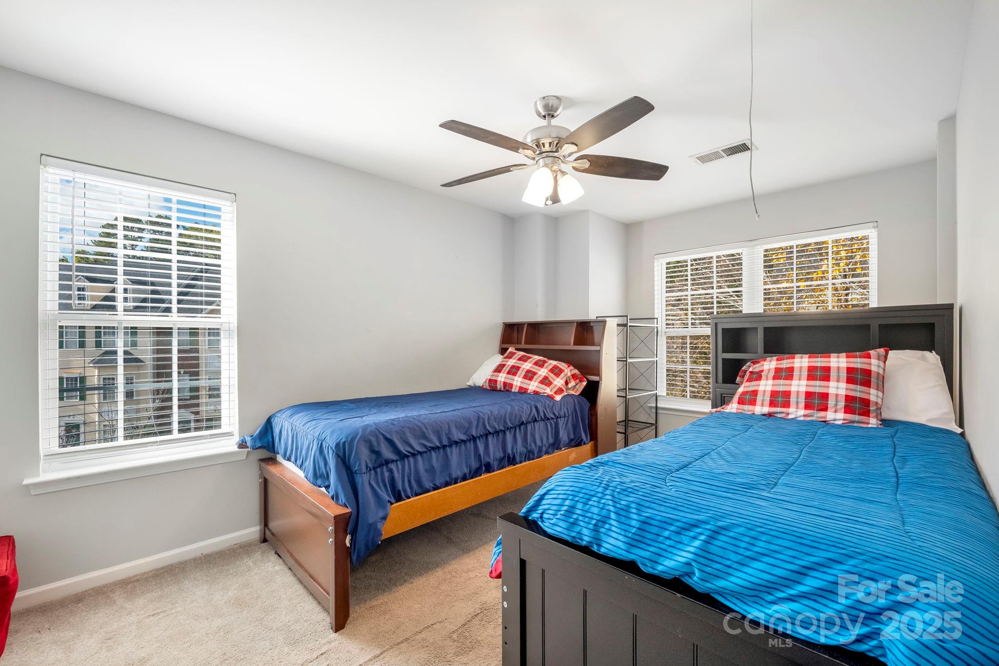 9919 Treeside Lane Matthews, NC 28105 - Photo 11 of 16 a bedroom with a bed and window