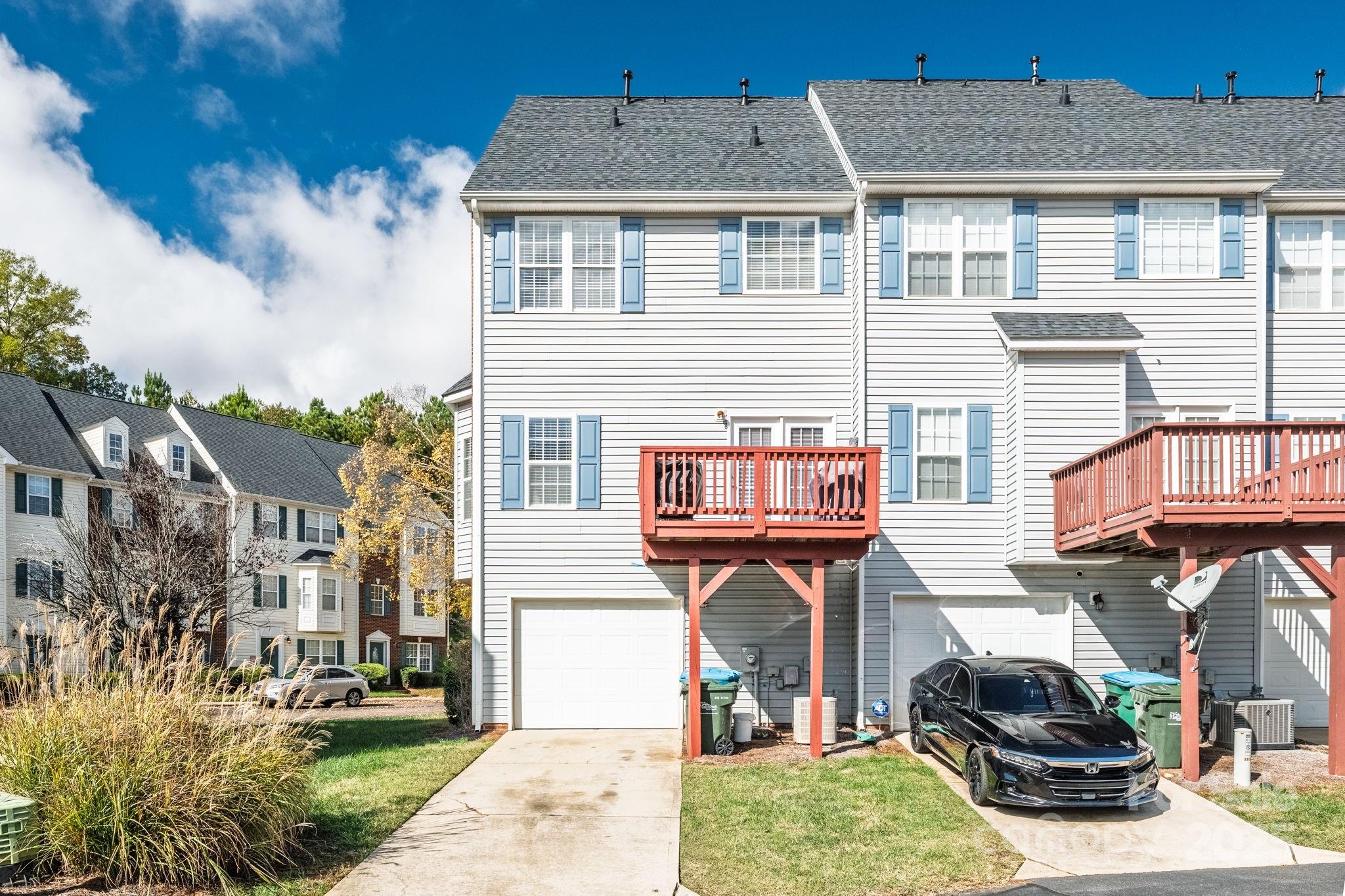 9919 Treeside Lane Matthews, NC 28105 - Photo 16 of 16 a front view of a residential apartment building with a yard