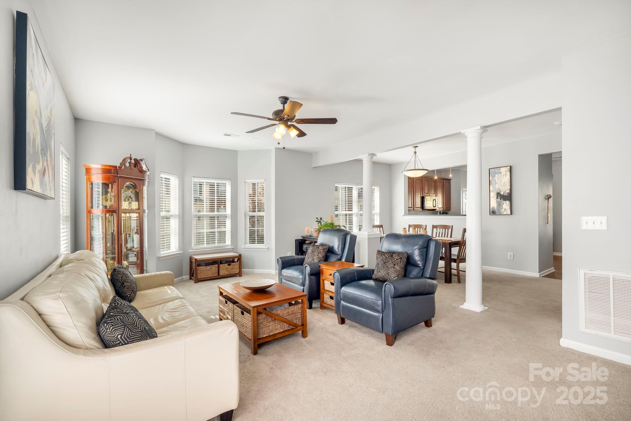 9919 Treeside Lane Matthews, NC 28105 - Photo 3 of 16 a living room with furniture and a large window