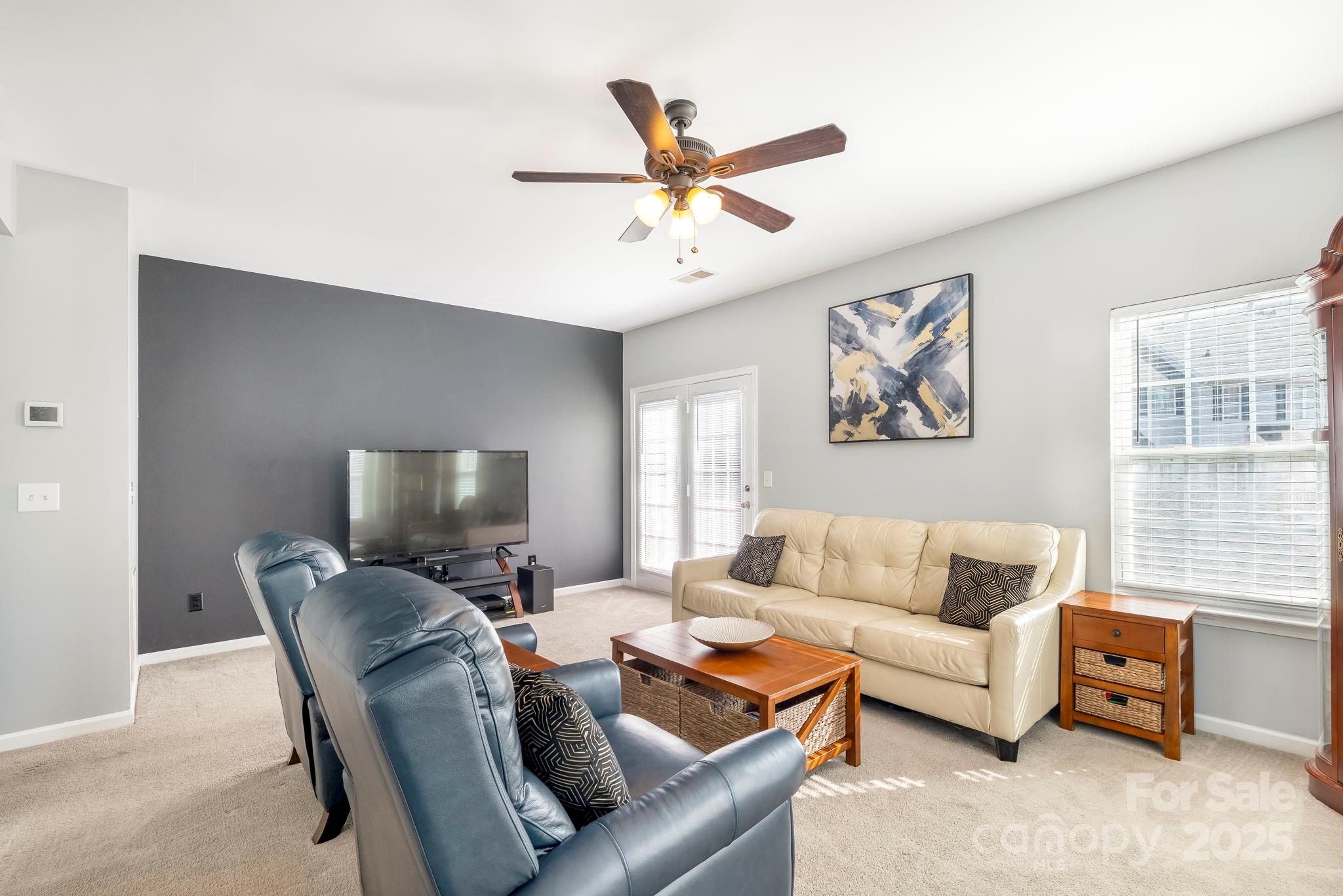 9919 Treeside Lane Matthews, NC 28105 - Photo 4 of 16 a living room with furniture and a window