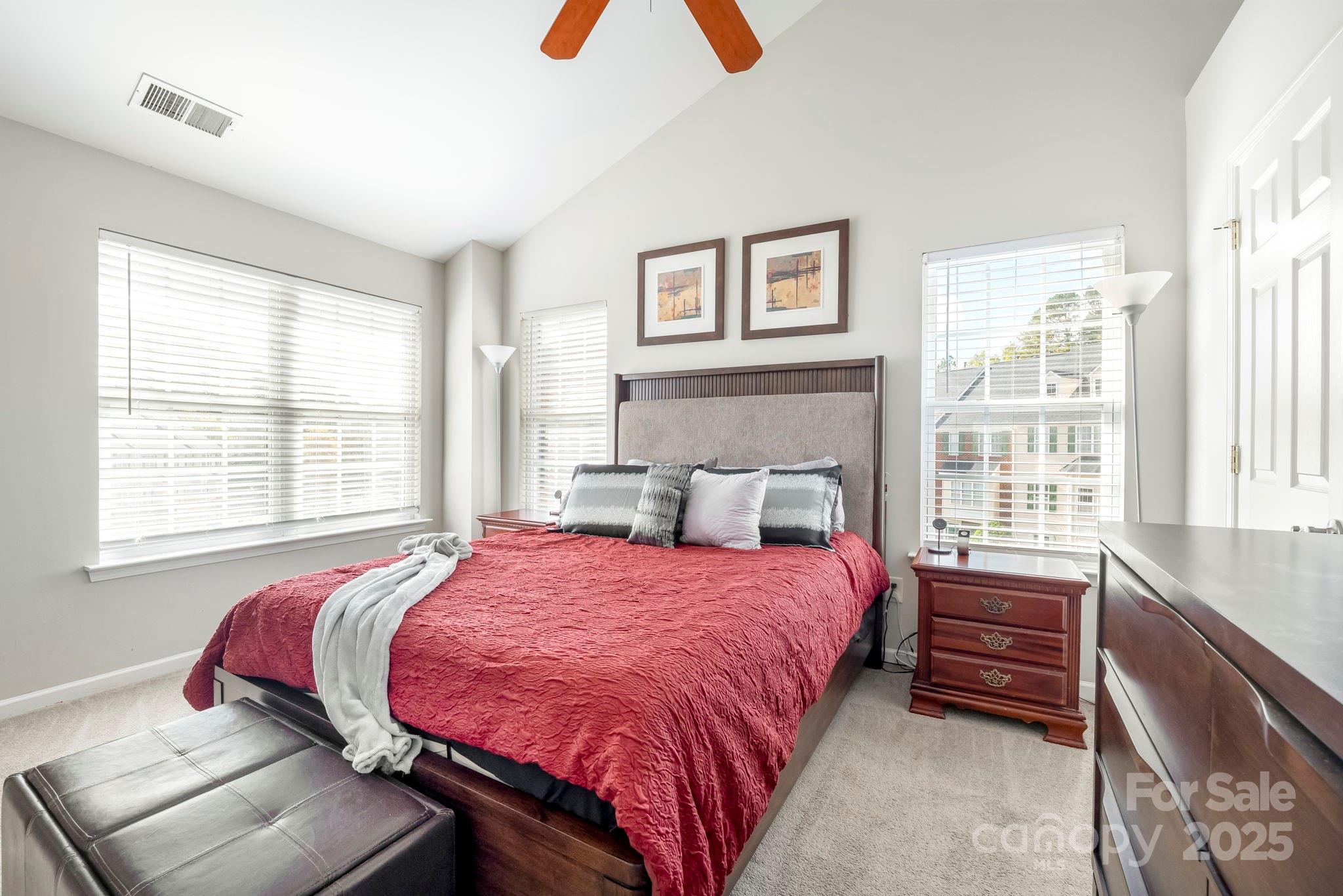 9919 Treeside Lane Matthews, NC 28105 - Photo 8 of 16 a bedroom with a bed and a large window
