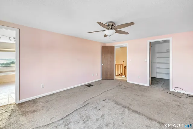 a view of an empty room and window