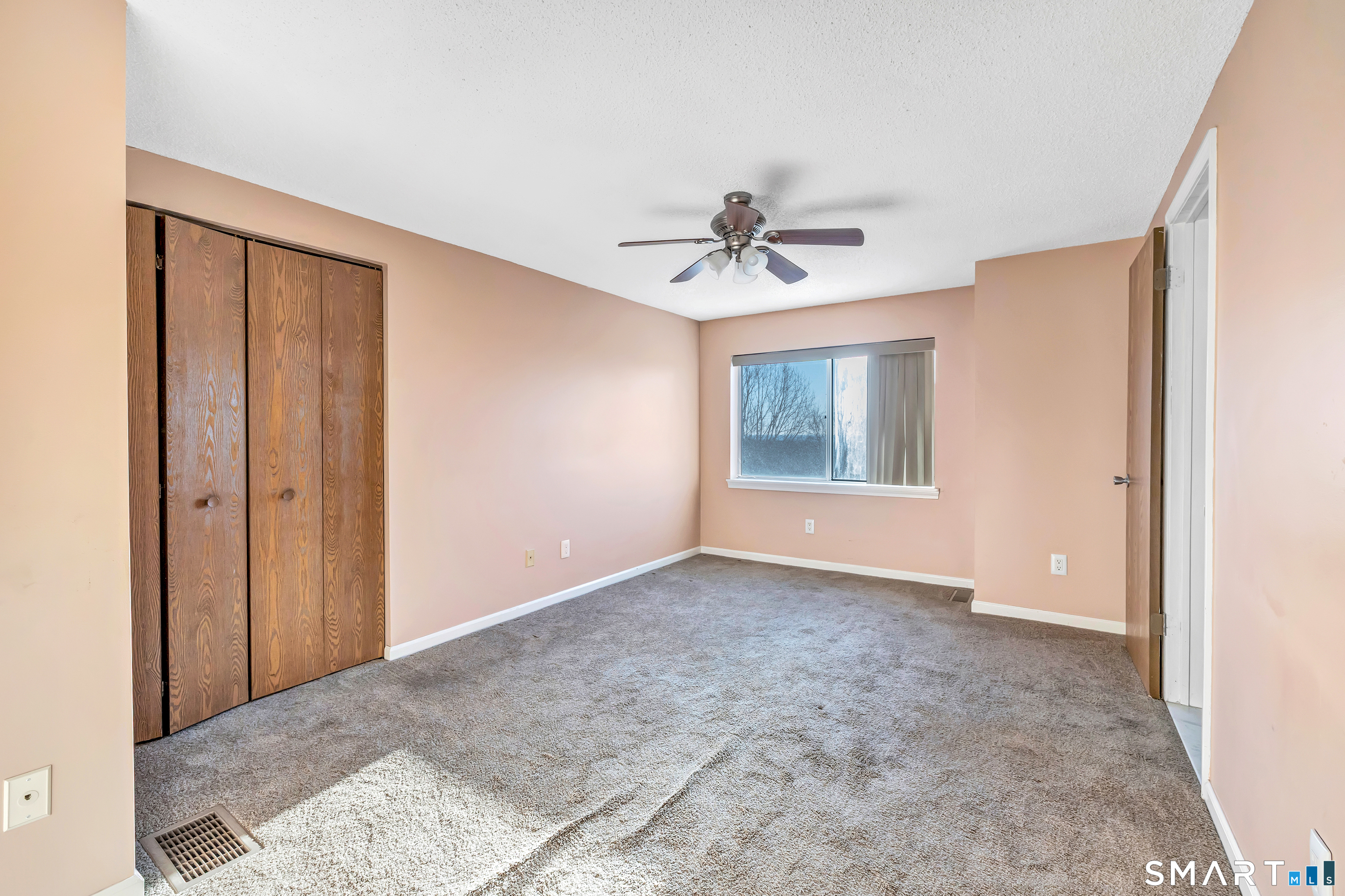 675 Townsend Avenue, Unit 104 New Haven, CT 06512 - Photo 17 of 40 a view of an empty room with a window