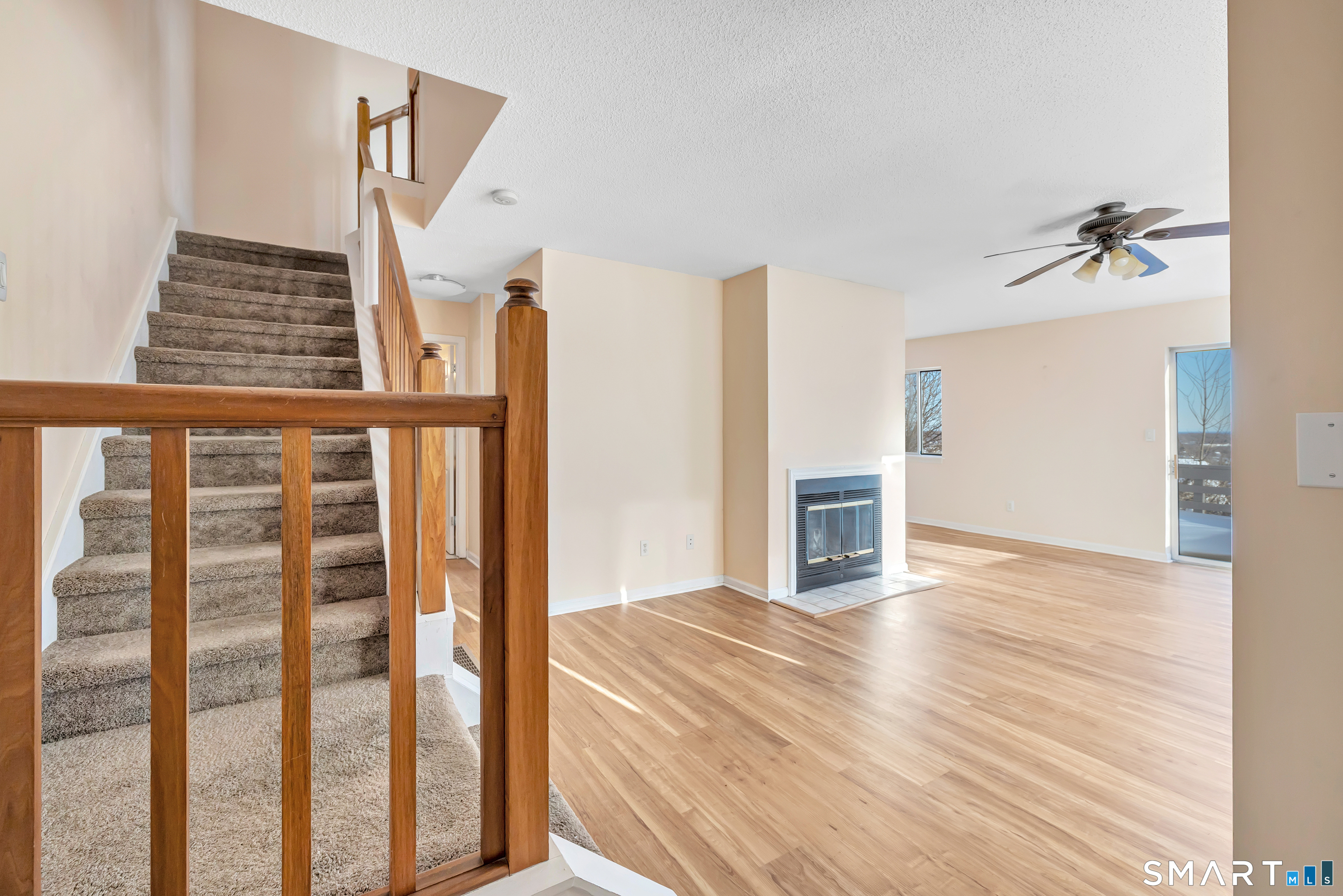 675 Townsend Avenue, Unit 104 New Haven, CT 06512 - Photo 2 of 40 a view of a hallway with wooden floor and staircase