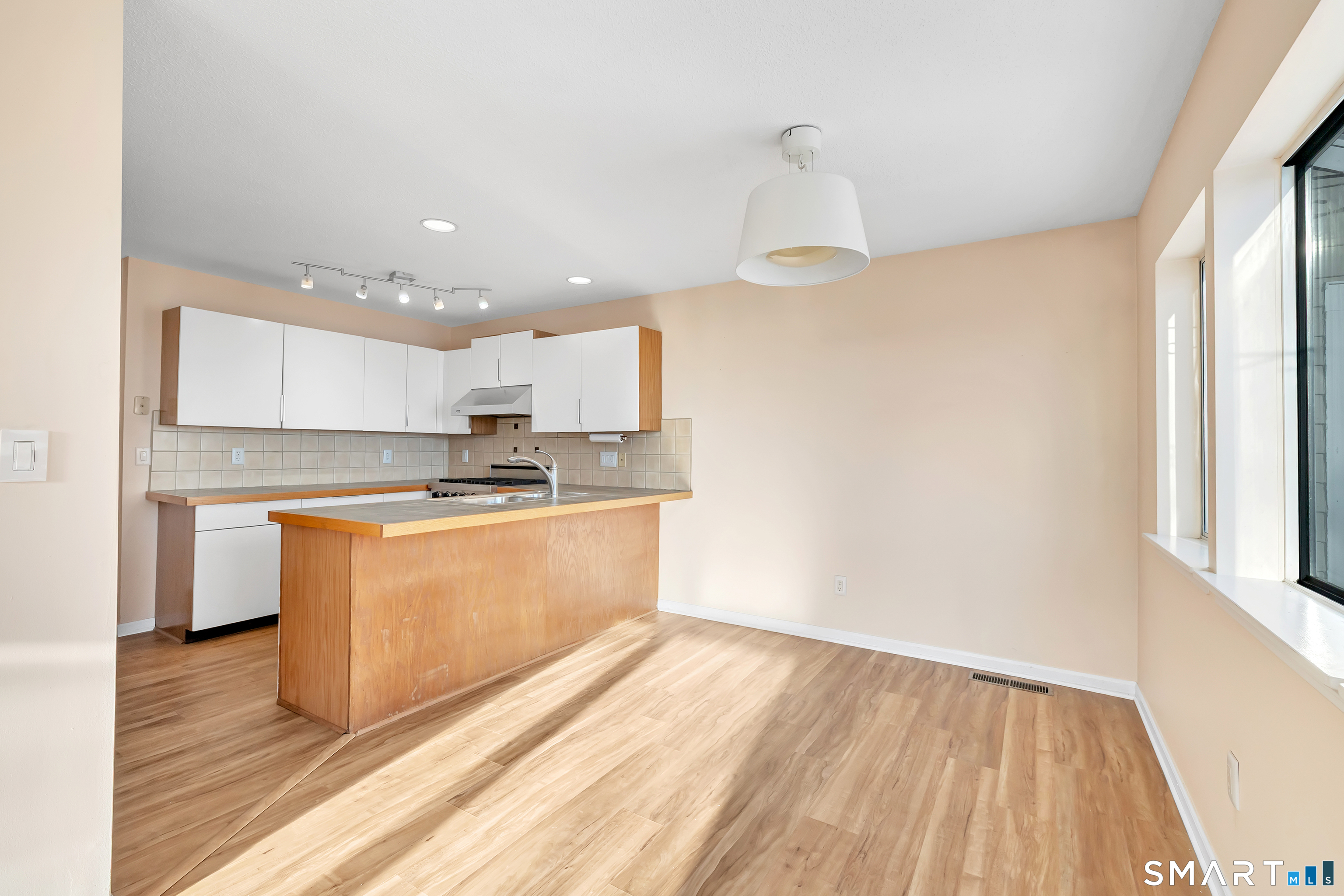 675 Townsend Avenue, Unit 104 New Haven, CT 06512 - Photo 27 of 40 a view of kitchen with granite countertop cabinets and outdoor space