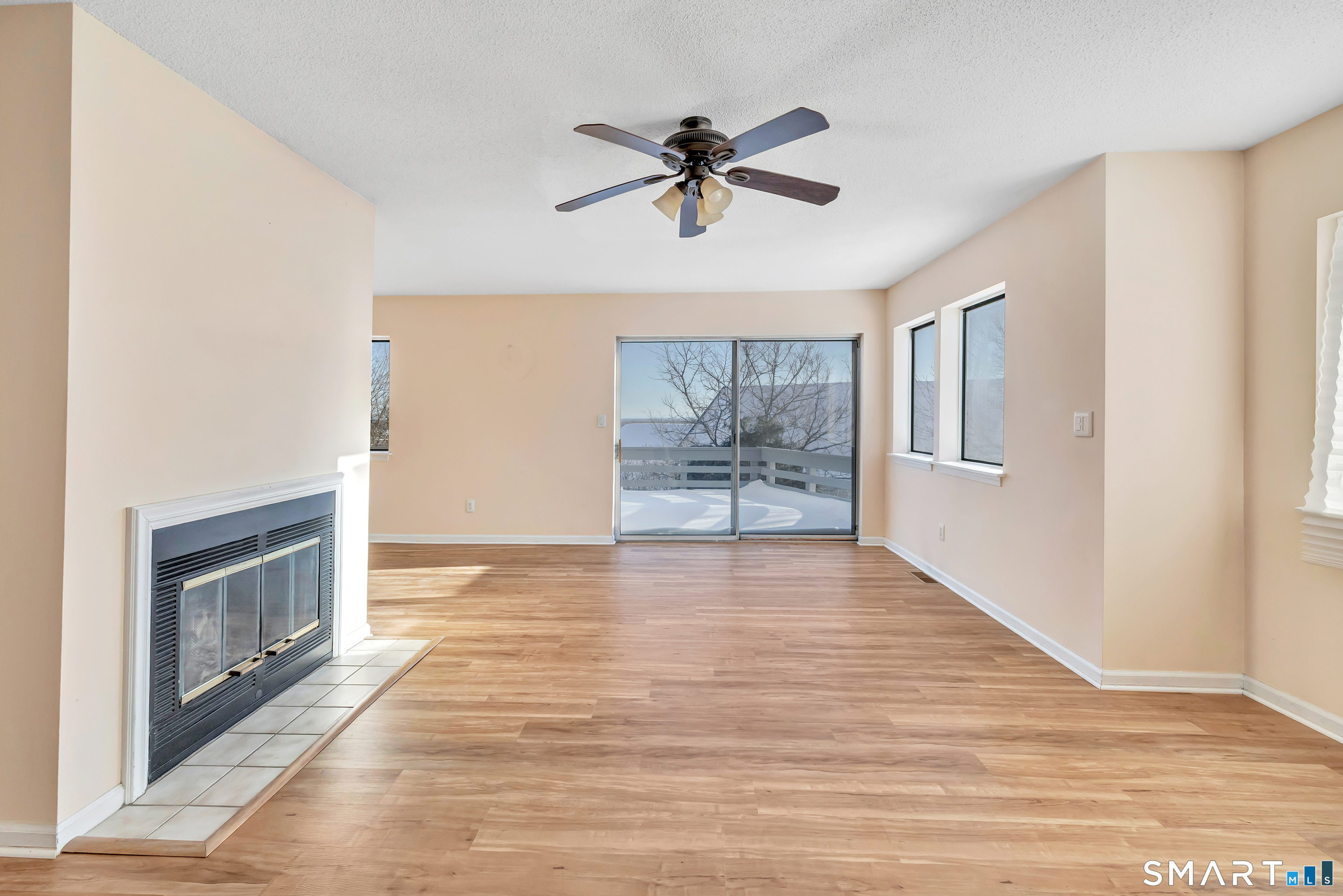 675 Townsend Avenue, Unit 104 New Haven, CT 06512 - Photo 5 of 40 a view of empty room with wooden floor and fan