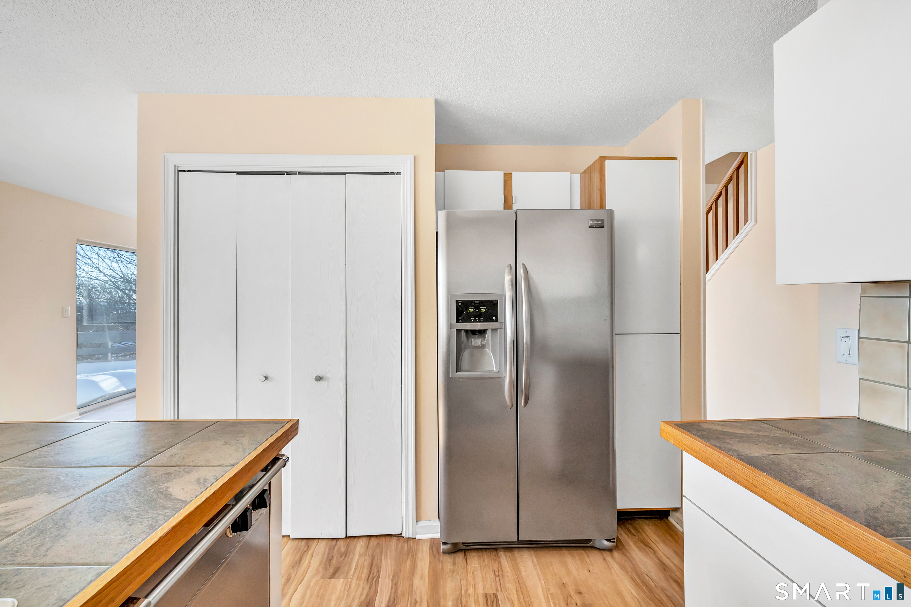 675 Townsend Avenue, Unit 104 New Haven, CT 06512 - Photo 7 of 40 a kitchen with stainless steel appliances granite countertop a refrigerator and a sink