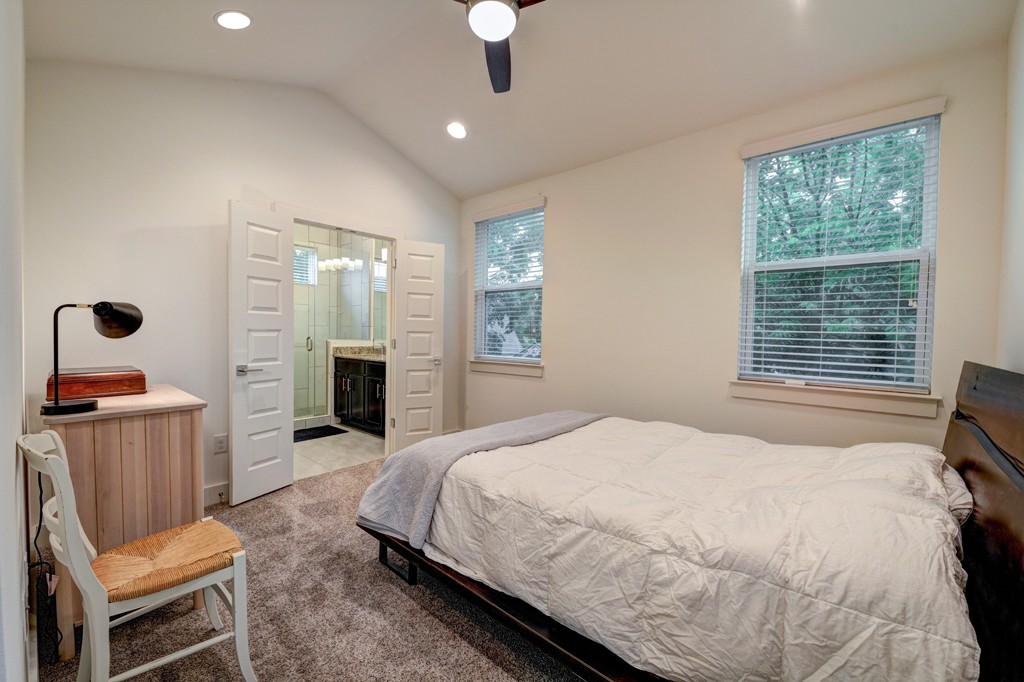 1300 Walnut Avenue, Unit B Austin, TX 78702 - Photo 10 of 15 a spacious bedroom with a bed and a television