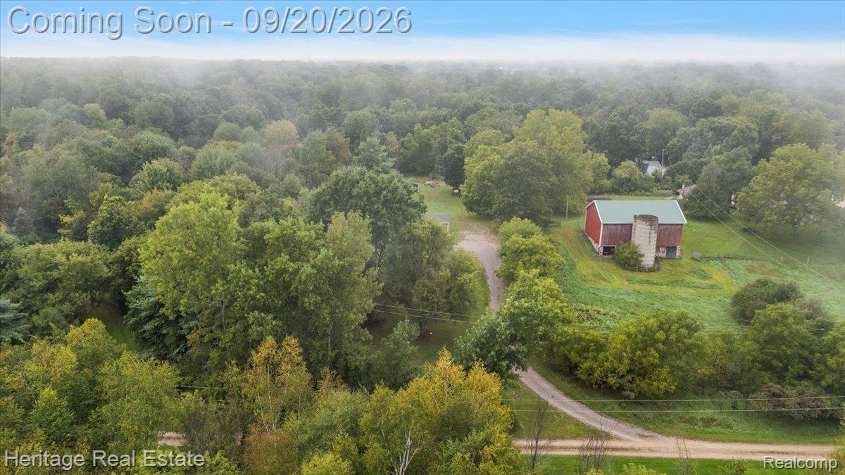 3337 Le Valley Road Columbiaville, MI 48421 - Photo 42 of 57 Red barn structure with a green roof
