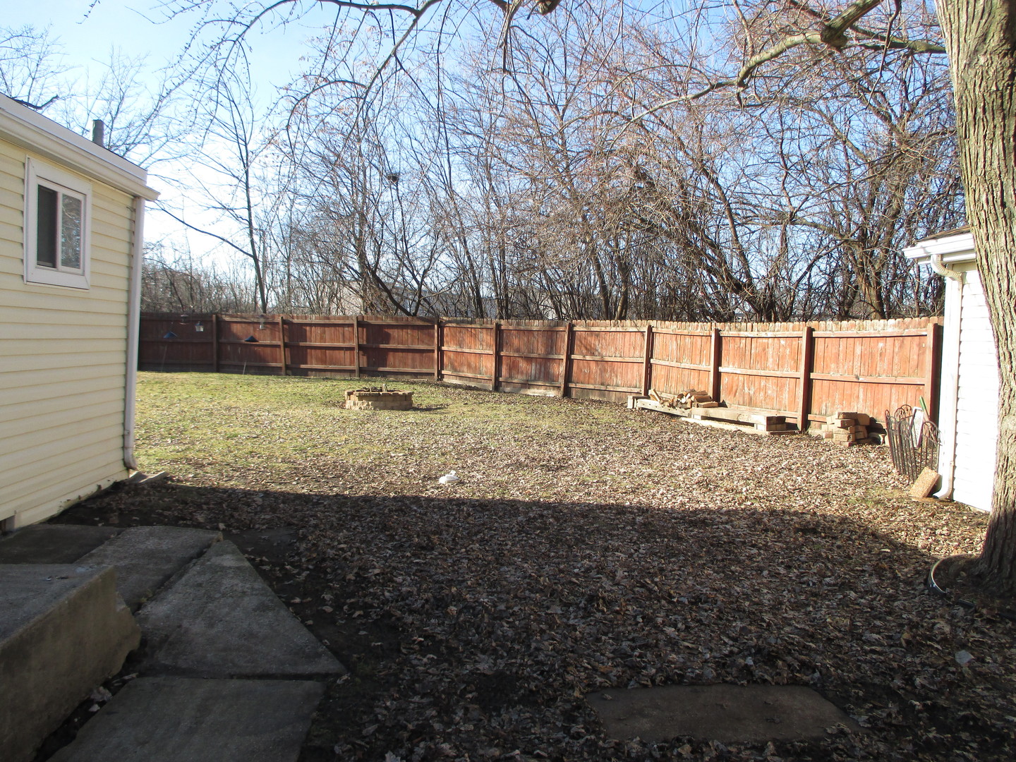 3902 Claire Boulevard Midlothian, IL 60445 - Photo 12 of 14 a view of a yard covered with snow