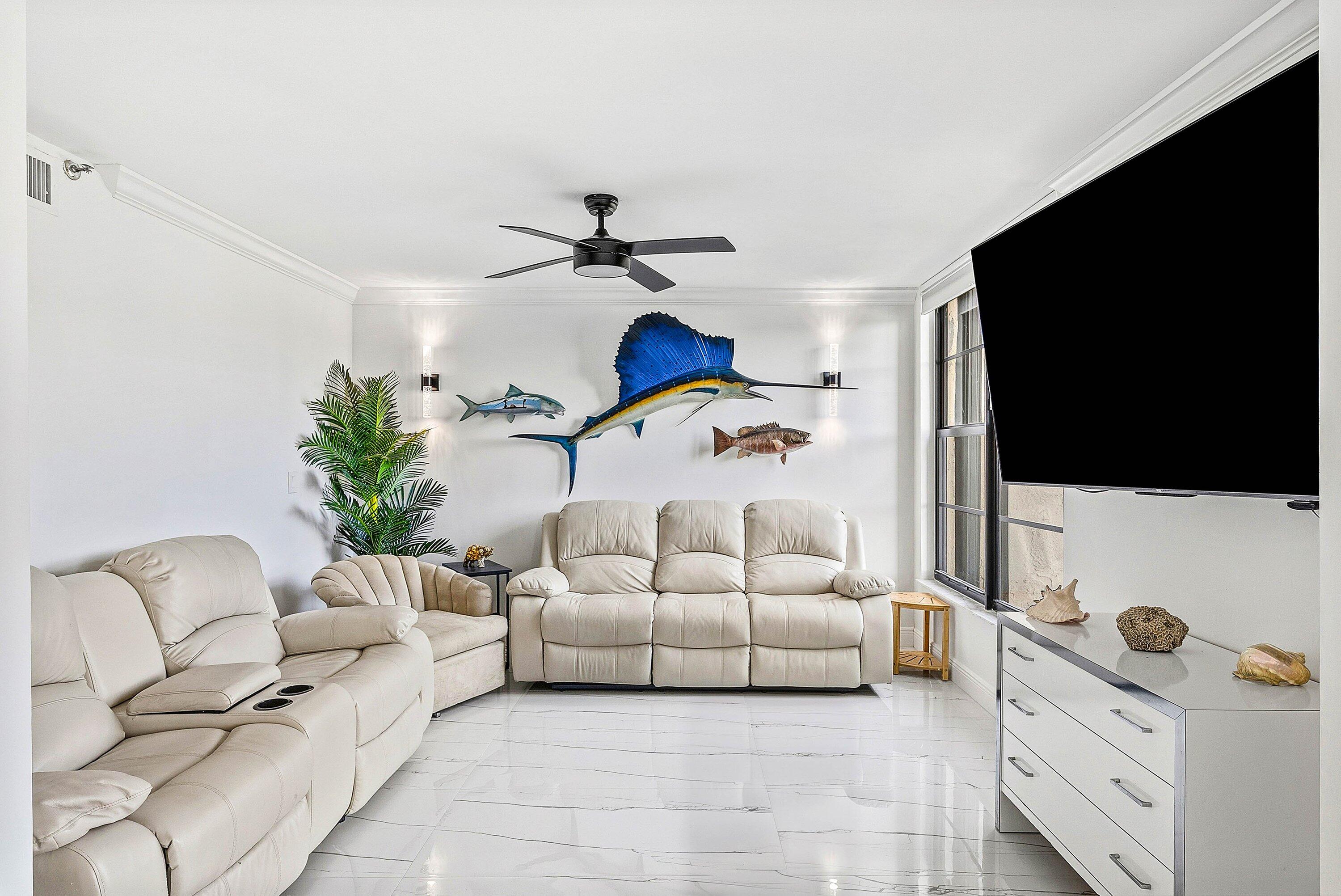 18 Royal Palm Way, Unit 109 Boca Raton, FL 33432 - Photo 15 of 43 a living room with furniture and a flat screen tv