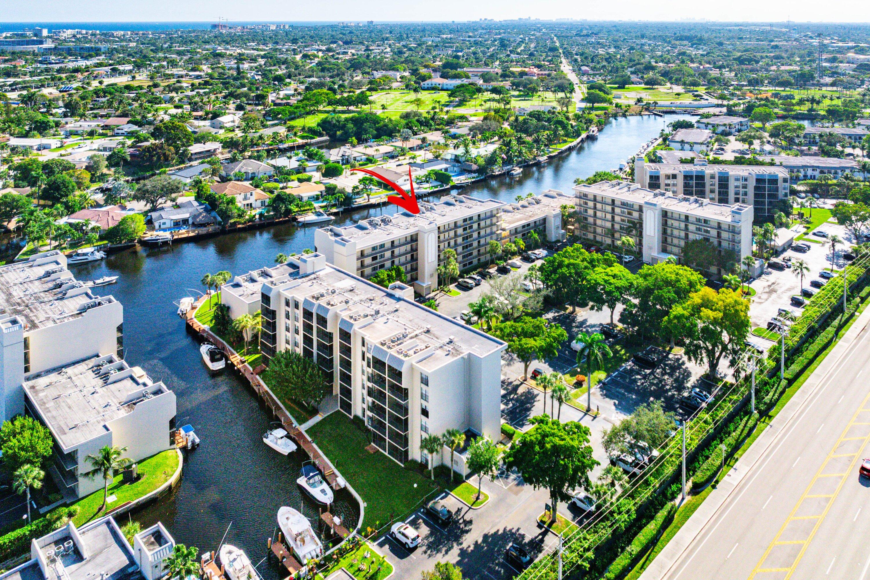 18 Royal Palm Way, Unit 109 Boca Raton, FL 33432 - Photo 38 of 43 an aerial view of lake and residential houses with outdoor space