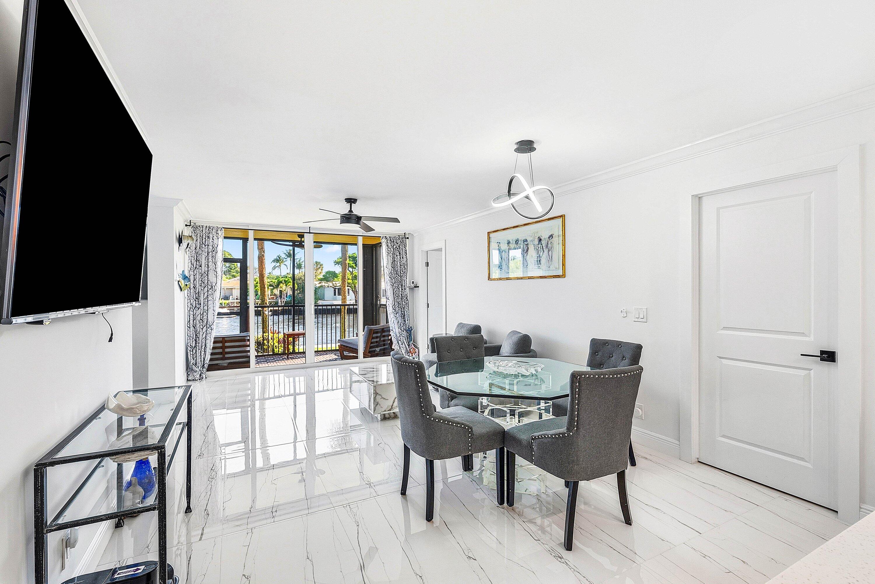 18 Royal Palm Way, Unit 109 Boca Raton, FL 33432 - Photo 10 of 43 a dining room with furniture and window