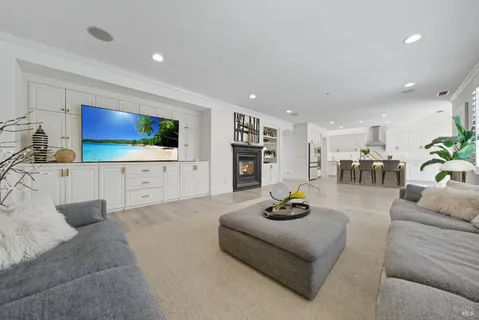a view of patio with table and chairs and potted plants
