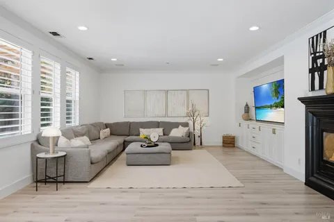 a view of a chairs and table in a backyard