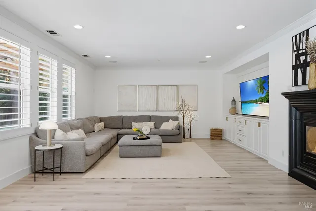 a view of a chairs and table in a backyard