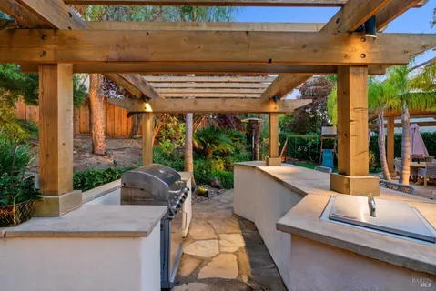 a view of a dining room with furniture and a potted plant