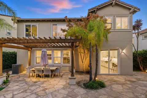 a living room with furniture and a lamp