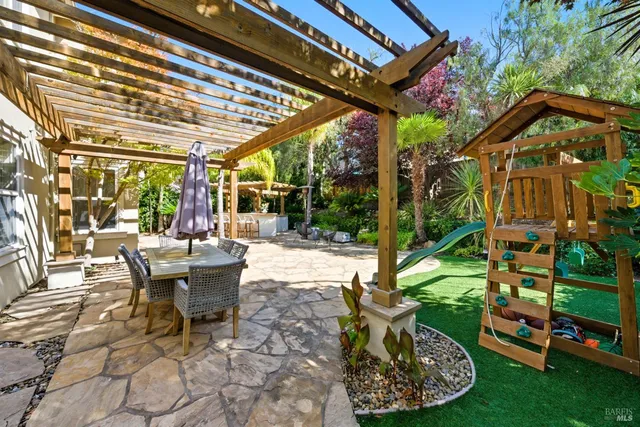 a front view of a house with a yard and a garage
