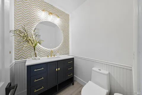 a kitchen with stainless steel appliances kitchen island sink refrigerator and stove