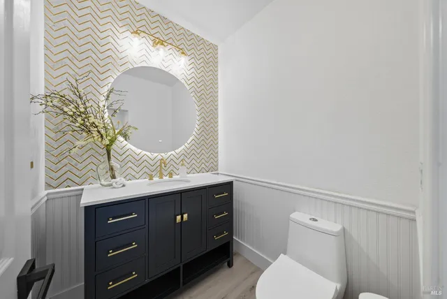 a kitchen with stainless steel appliances kitchen island sink refrigerator and stove