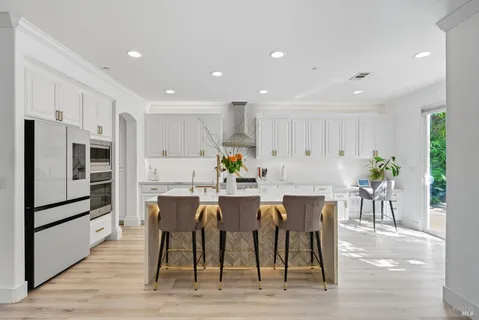 a close view of a stove a microwave and cabinets in the kitchen