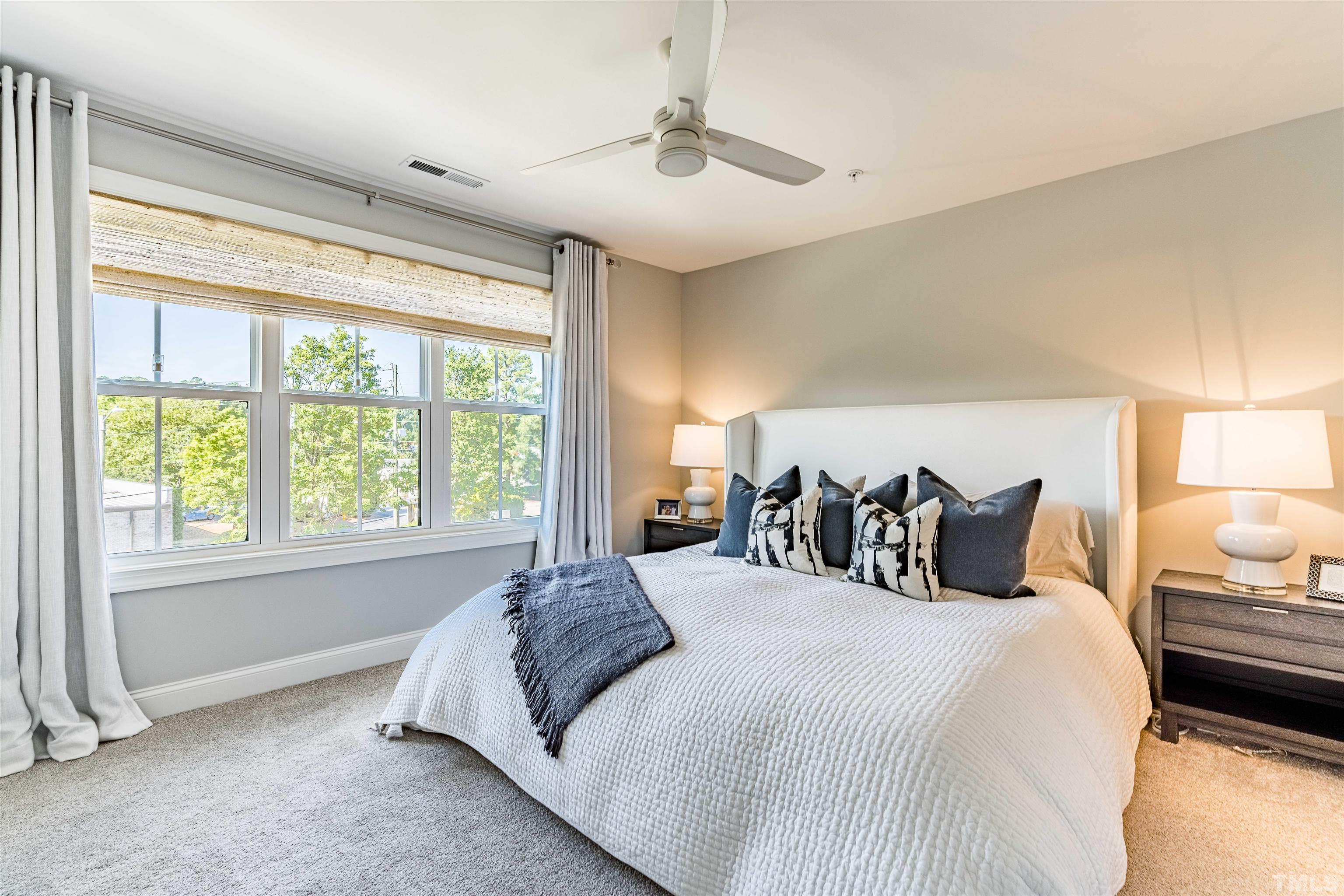 6801 Milligan Way, Unit 107 Raleigh, NC 27613 - Photo 12 of 27 a bed room with a bed and a window