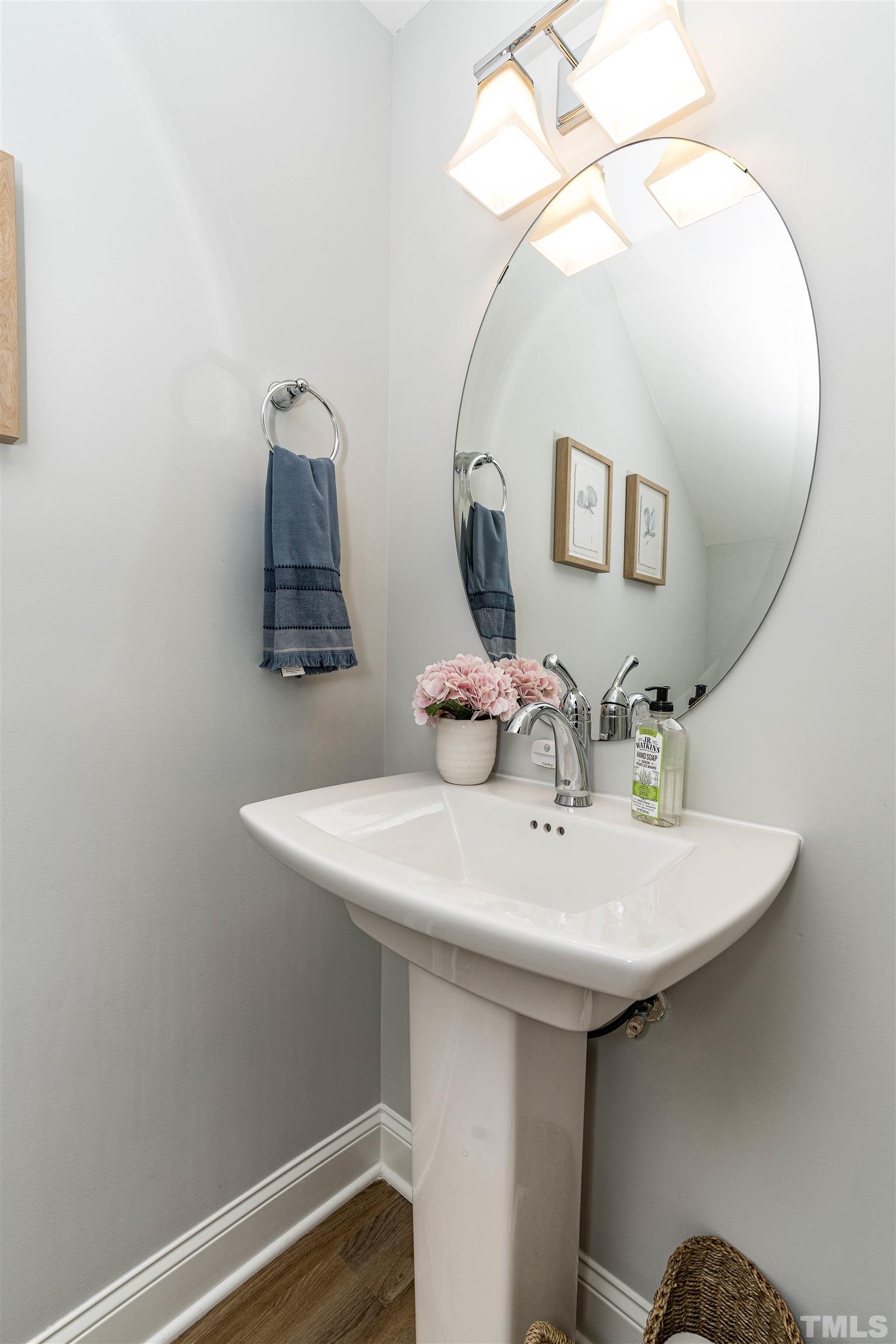 6801 Milligan Way, Unit 107 Raleigh, NC 27613 - Photo 13 of 27 a bathroom with a sink and a mirror