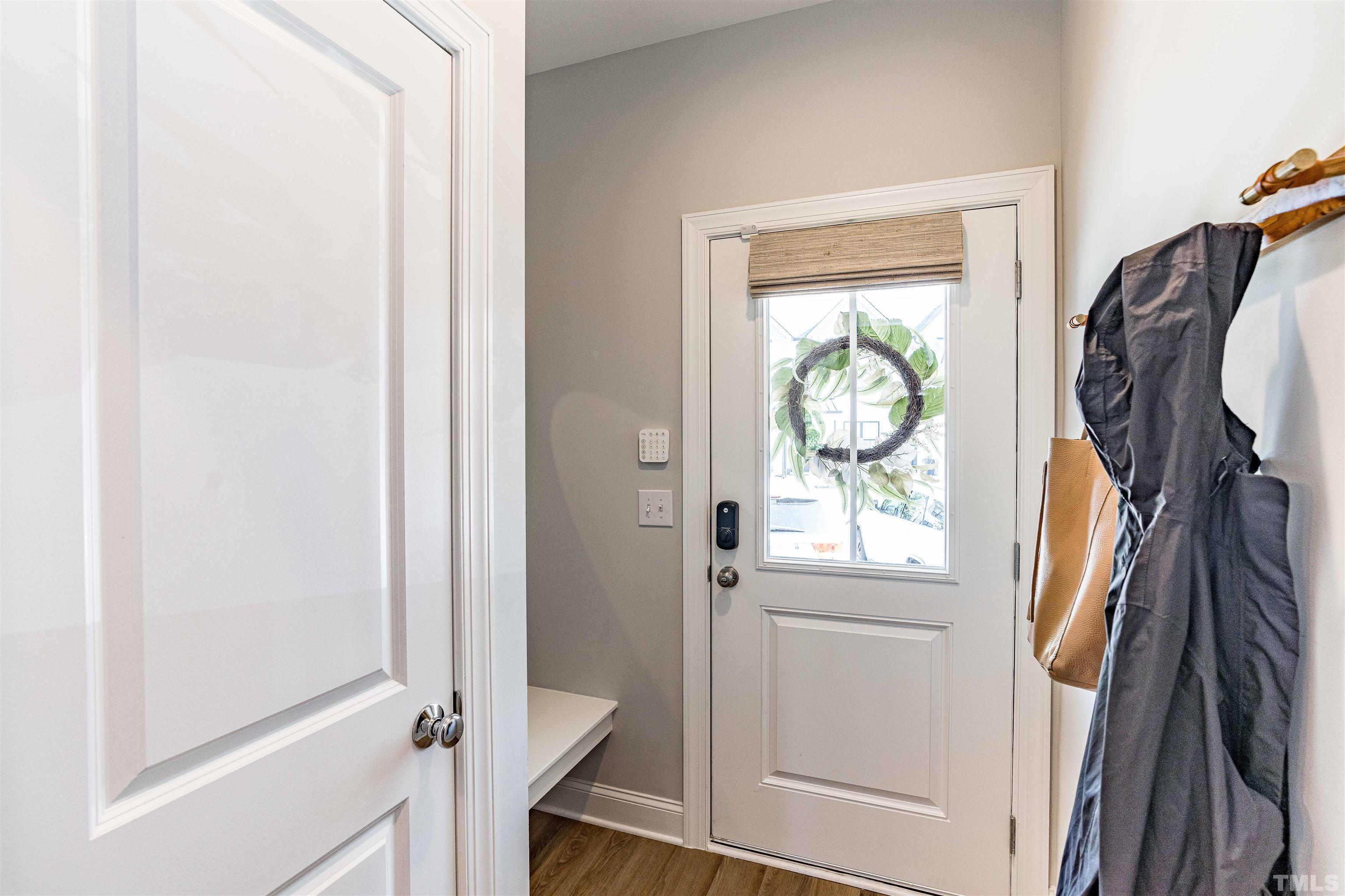 6801 Milligan Way, Unit 107 Raleigh, NC 27613 - Photo 2 of 27 a view of a door and a mirror