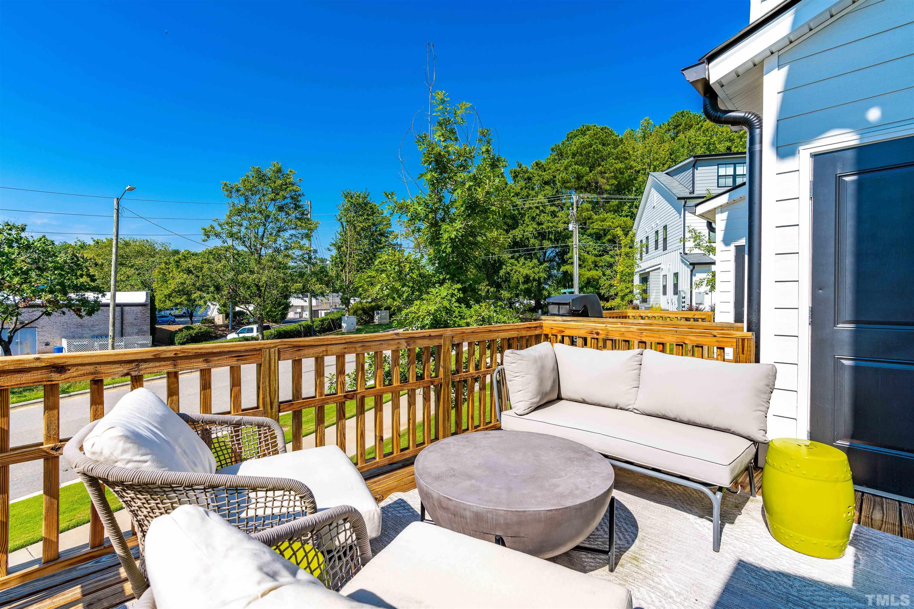 6801 Milligan Way, Unit 107 Raleigh, NC 27613 - Photo 25 of 27 a balcony with table and chairs