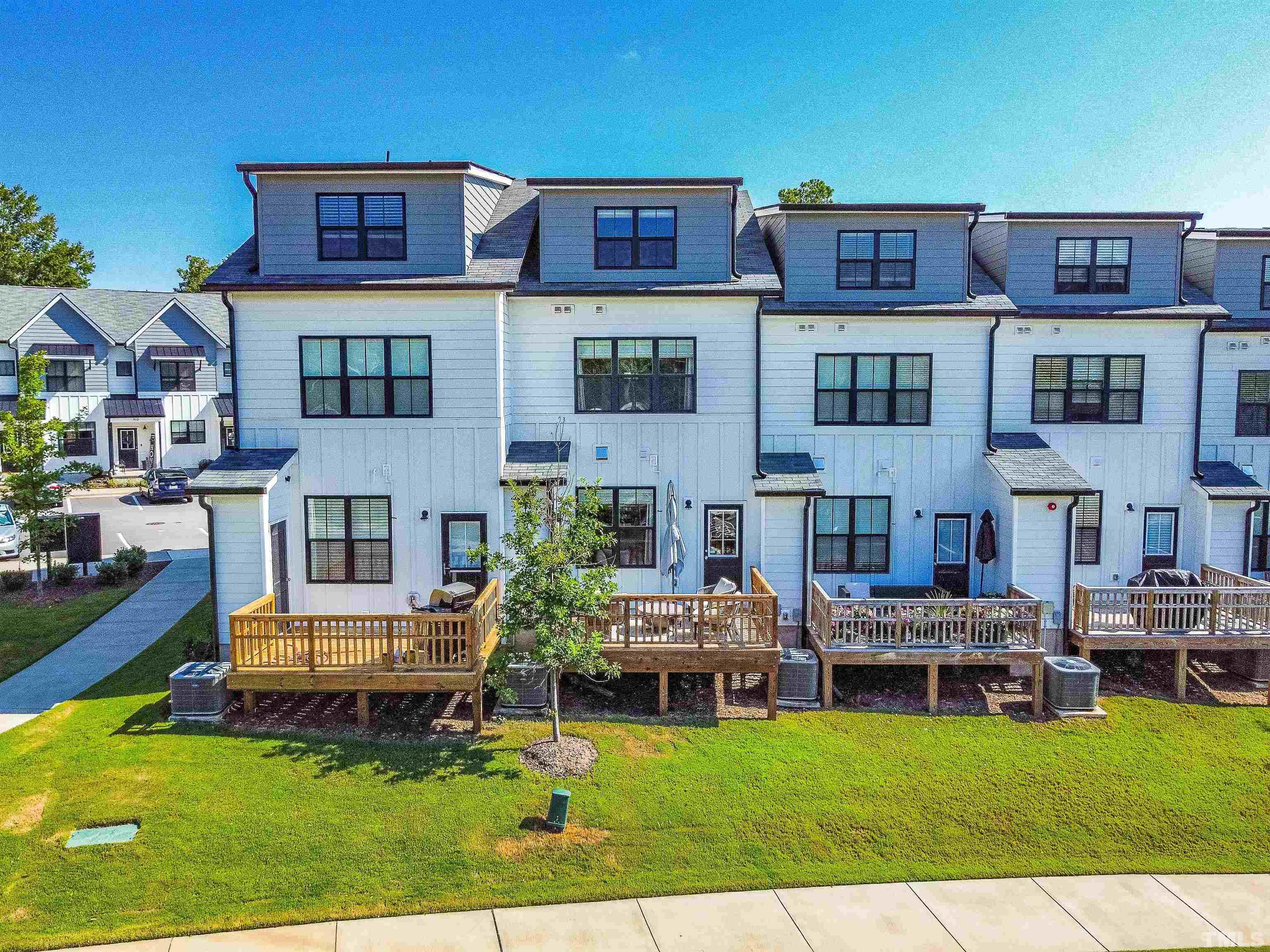6801 Milligan Way, Unit 107 Raleigh, NC 27613 - Photo 27 of 27 a view of a house with swimming pool and sitting area