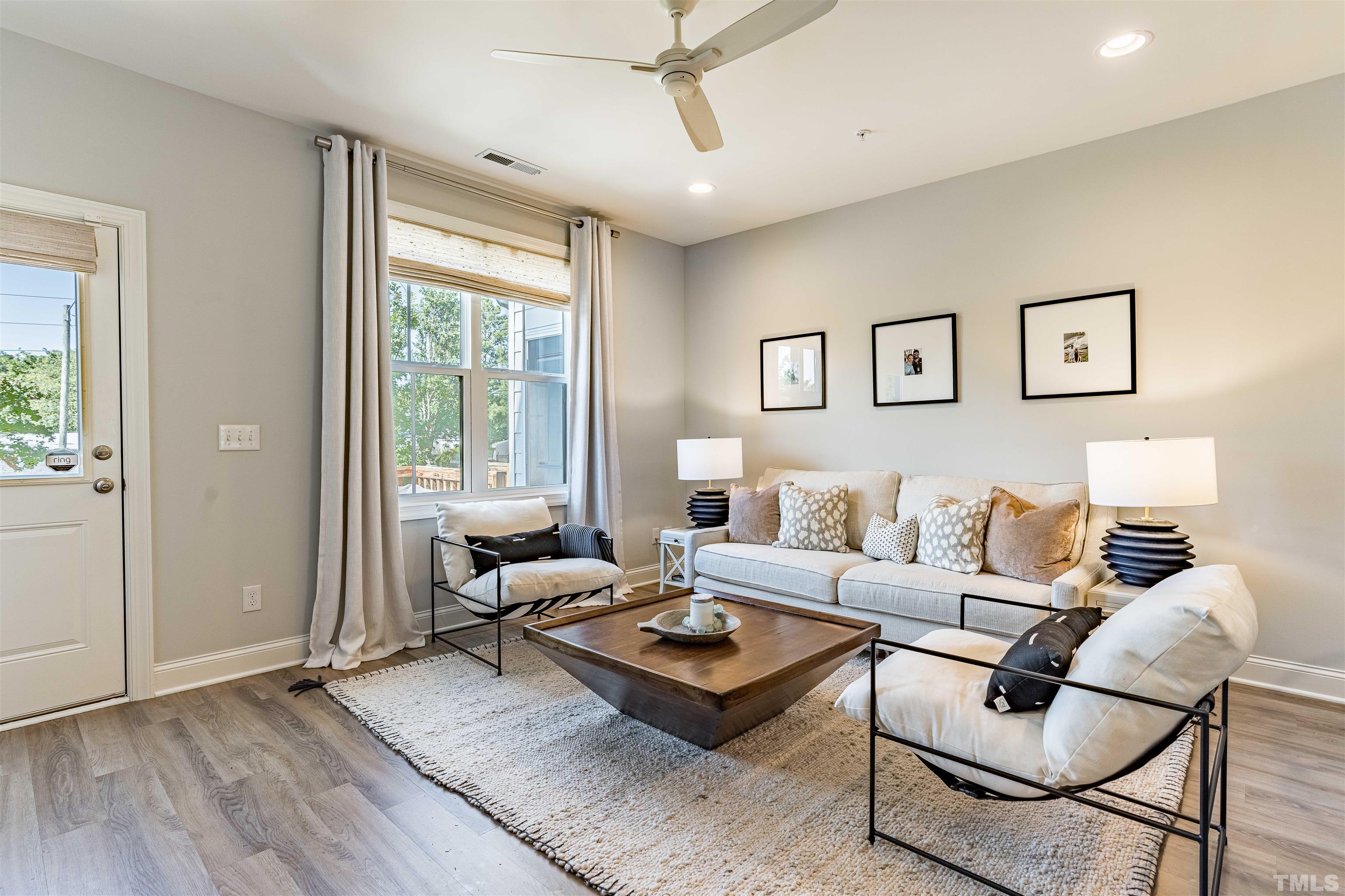 6801 Milligan Way, Unit 107 Raleigh, NC 27613 - Photo 10 of 27 a living room with furniture and a large window