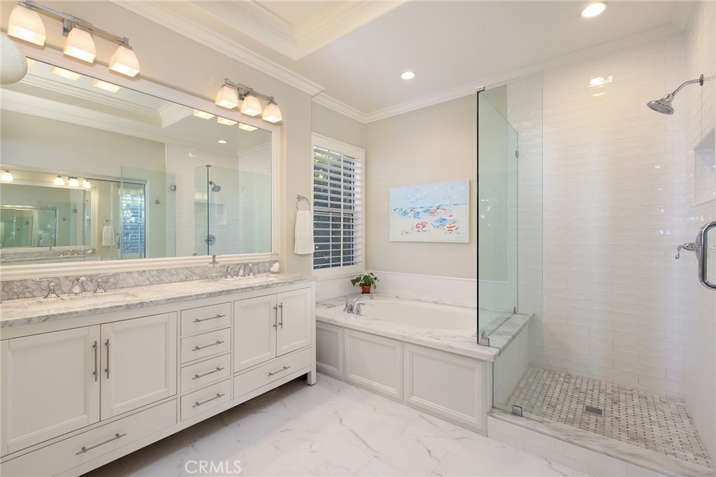 9 Chaminade Newport Coast, CA 92657 - Photo 16 of 29 a spacious bathroom with a double vanity sink a mirror and a bathtub