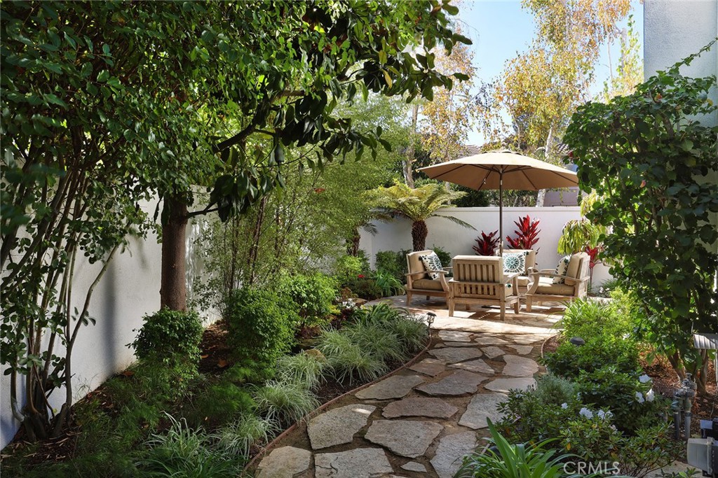 9 Chaminade Newport Coast, CA 92657 - Photo 21 of 29 a view of a patio with furniture and a umbrella