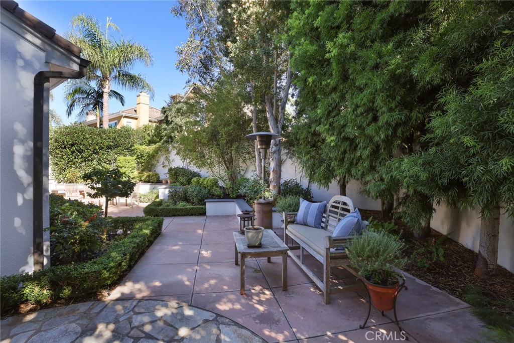 9 Chaminade Newport Coast, CA 92657 - Photo 22 of 29 a view of a patio with table and chairs and potted plants