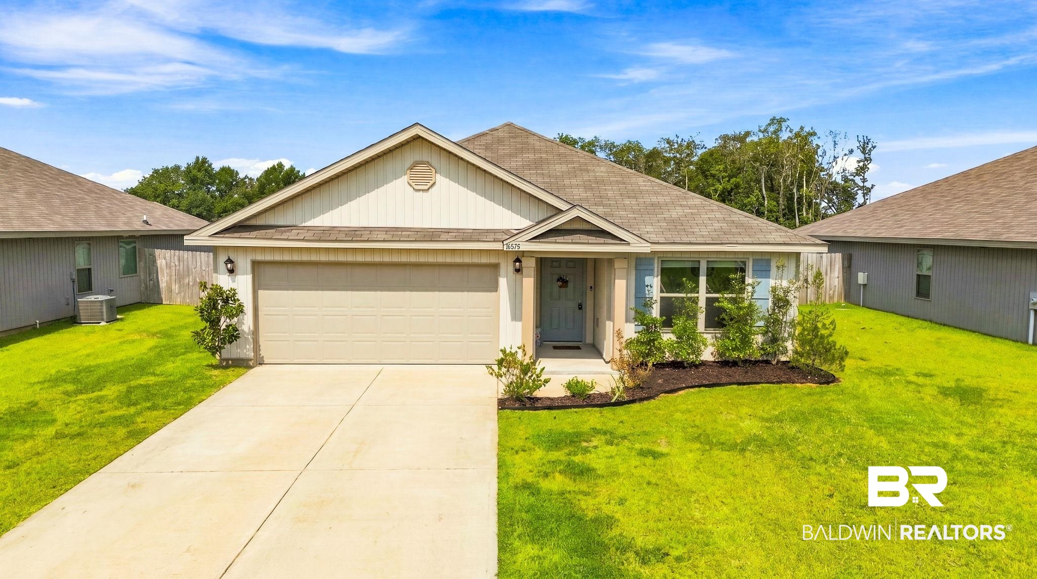 32155 Terranova Loop Lillian, AL 36549 - Photo 13 of 37 Single-story residence featuring a neutral-toned exterior, concrete driveway, and attached garage