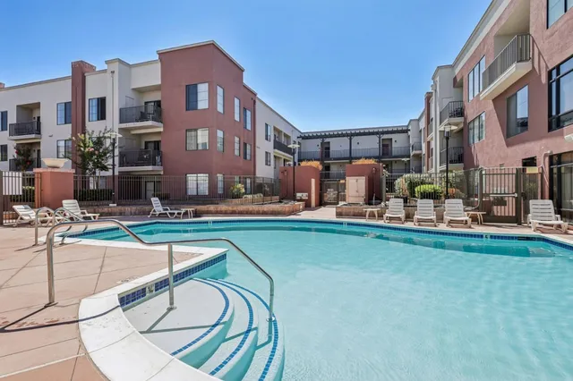 a view of a patio with swimming pool