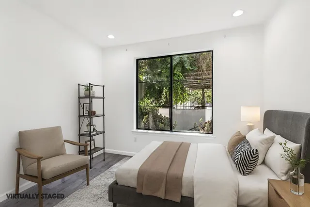 a bedroom with a bed and a couch