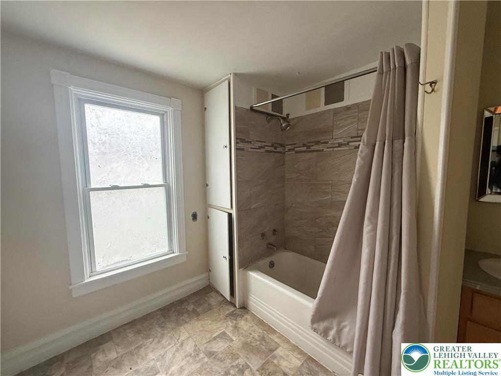 3714 Old Mill Road Slatington, PA 18080 - Photo 17 of 18 a bathroom with a glass shower door and a window