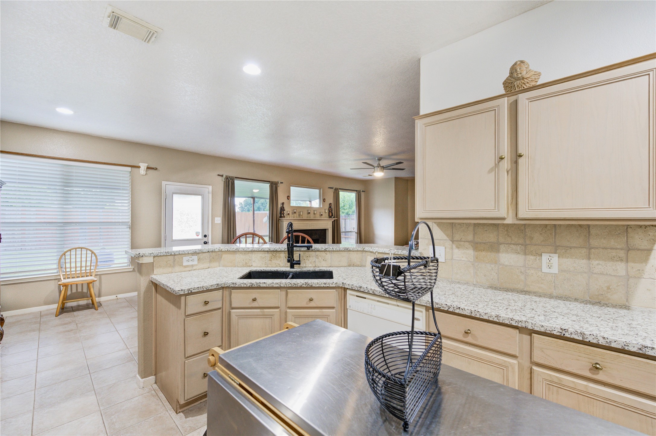 16730 Spring Barker Drive Cypress, TX 77429 - Photo 26 of 50 a kitchen with granite countertop cabinets a sink and appliances